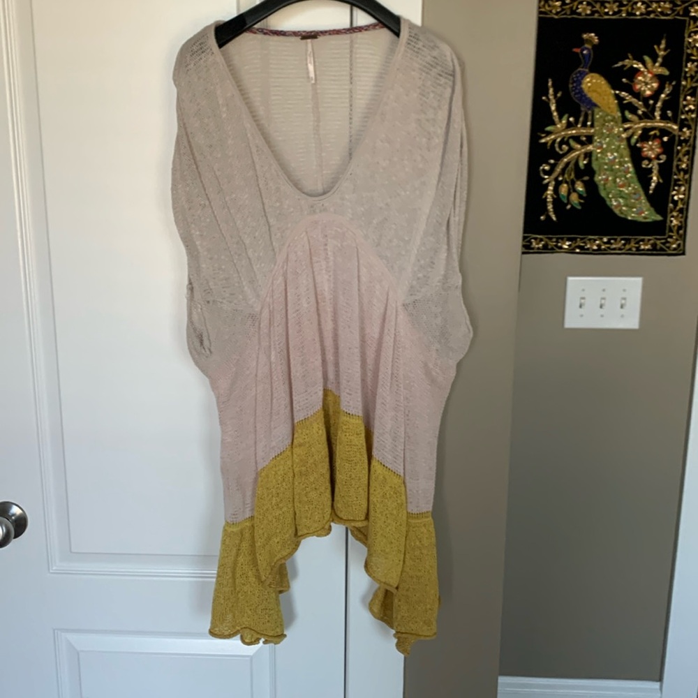 Free People. Size small. Lightweight and oversized multi color sweater.